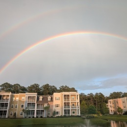 a building with a rainbow over it