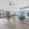 Large fitness center with large windows and plenty of equipment