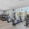 Large fitness center with large windows and plenty of equipment